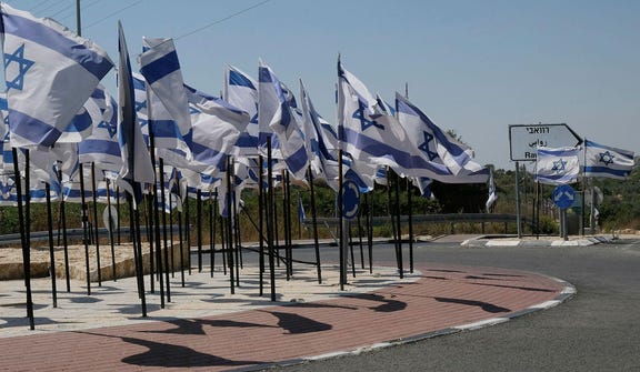 Israeli flags in the occupied West Bank, earlier this year. Credit: Alex Levac Israeli flags in the occupied West Bank, earlier this year.