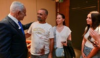Prime Minister Benjamin Netanyahu meets with Yaniv Hayoun, one of the passengers who broke into the cockpit during the Flydubai hijacking attempt. Credit: Kobi Gideon/BauBau Prime Minister Benjamin Netanyahu meets with Yaniv Hayoun, one of the passengers who broke into the cockpit during the Flydubai hijacking attempt.