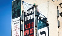 Workers remove an Otzma Yehudit party billboard at the entrance to Jerusalem on Thursday. Credit: Itay Cohen Workers remove an Otzma Yehudit party billboard at the entrance to Jerusalem on Thursday.