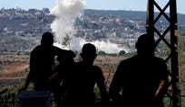 People from Mansouri in southern Lebanon watching smoke billow from an Israeli-controlled detonation destroying their village, as seen from Hanniyeh village last month.