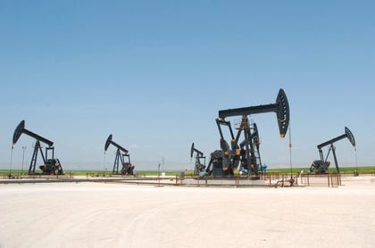 Oil pump jacks pump oil at the Al-Jbessa oil refinery in Syria.