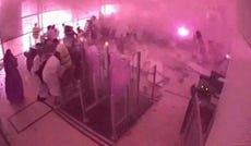 Surveillance footage shows smoke and fire as people react at the moment of an attack at King Khalid International Airport in Riyadh, Saudi Arabia, on Sunday.