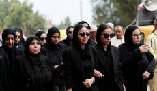 Mourners react during the funeral of of Azza Ramzy, a 28-year-old Egyptian flight attendant killed in the attack at Riyadh airport, in her home village of Al-Atf, El Mahmoudia district, Beheira Governorate, north of Cairo, Egypt, Tuesday.