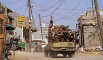 A truck loaded with firewood drives through the Al-Basateen neighborhood in Aden, Yemen, Tuesday, Oct. 13, 2026.