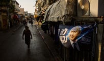 An election campaign banner featuring Israeli Prime Minister Benjamin Netanyahu, leader of the Likud party, hangs on a store ahead of Israel's general election in Tel Aviv, Israel, Monday, Oct. 12, 2026. (AP Photo/Oded Balilty)