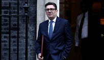 Britain's Prime Minister Andy Burnham leaves 10 Downing Street in central London on Wednesday to take part in the weekly session of 'Prime Minister's Questions' at Parliament.