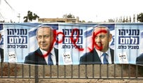 A Likud campaign ad featuring Prime Minister Benjamin Netanyahu with the word "guilty" spray-painted over it in red.