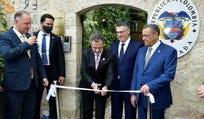 Colombian Foreign Minister Omar Bula cuts a ribbon as Israeli Foreign Minister Gideon Sa'ar stands by during the opening of Colombia's embassy in Jerusalem, Wednesday.