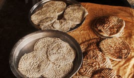 Different types of bread before and after baking. The stamps were used to distinguish between loaves and served as identifying marks for bakeries. Different types of bread before and after baking. The stamps were used to distinguish between loaves and served as identifying marks for bakeries.