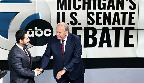 U.S. Senate candidates Democrat Abdul El-Sayed, left, and Republican Mike Rogers shake hands before the debate on Wednesday, Oct. 21, 2026. Credit: Robin Buckson/Detroit News via AP U.S. Senate candidates Democrat Abdul El-Sayed, left, and Republican Mike Rogers shake hands before the debate on Wednesday, Oct. 21, 2026