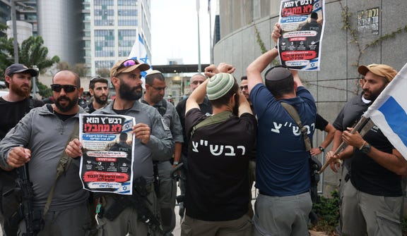 Settlers demonstrating at defense headquarters in Tel Aviv against the Shin Bet security service's detention of settler security-squad members, last week.