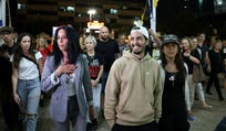 Einav Zangauker, left, walking alongside former hostages Matan Zangauker, her son, center, and Ilana Gritzewsky, last year after their return in a hostage deal.