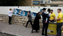 Ultra-Orthodox voters outside a Jerusalem polling station on Tuesday, Israel's Election Day.