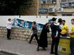 Kippot with pictures of rabbis, a willow branch for every voter: Election Day in the ultra-Orthodox street